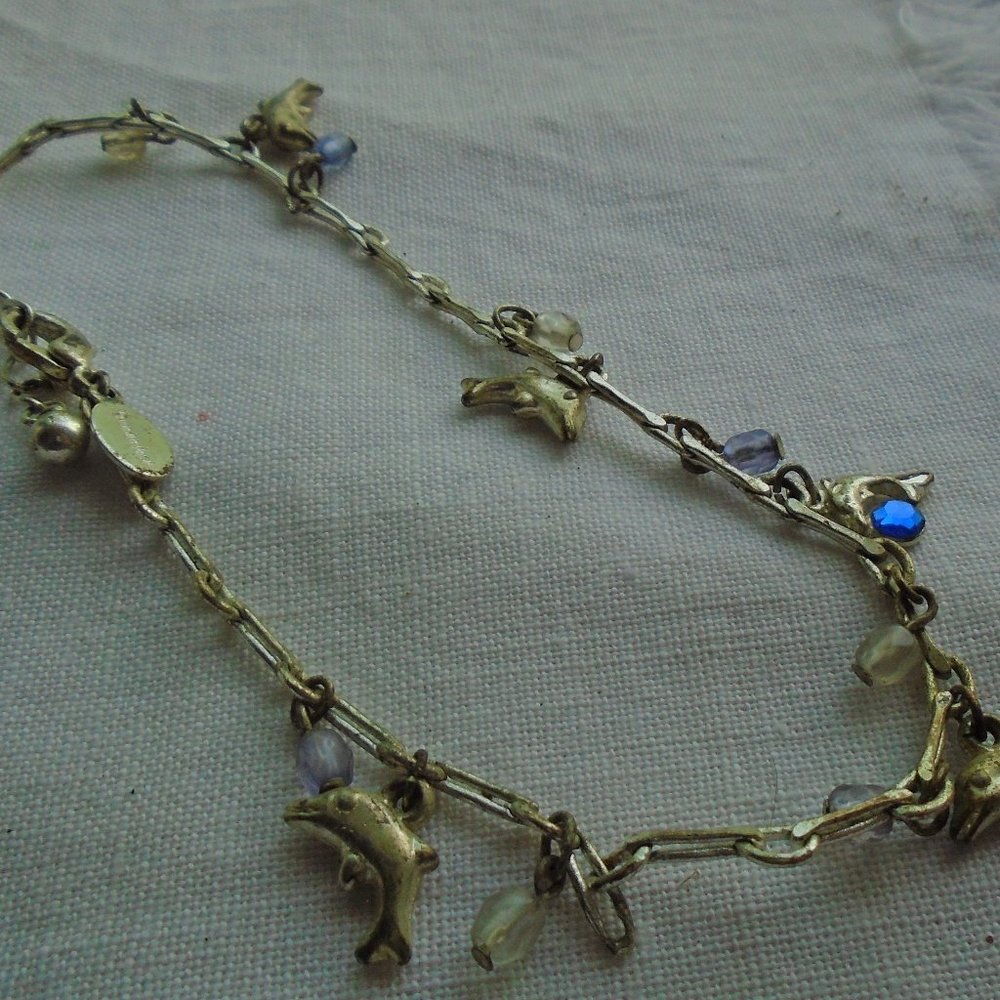 Someone hand me pinacoloda Panama Jack dolphin bracelet
